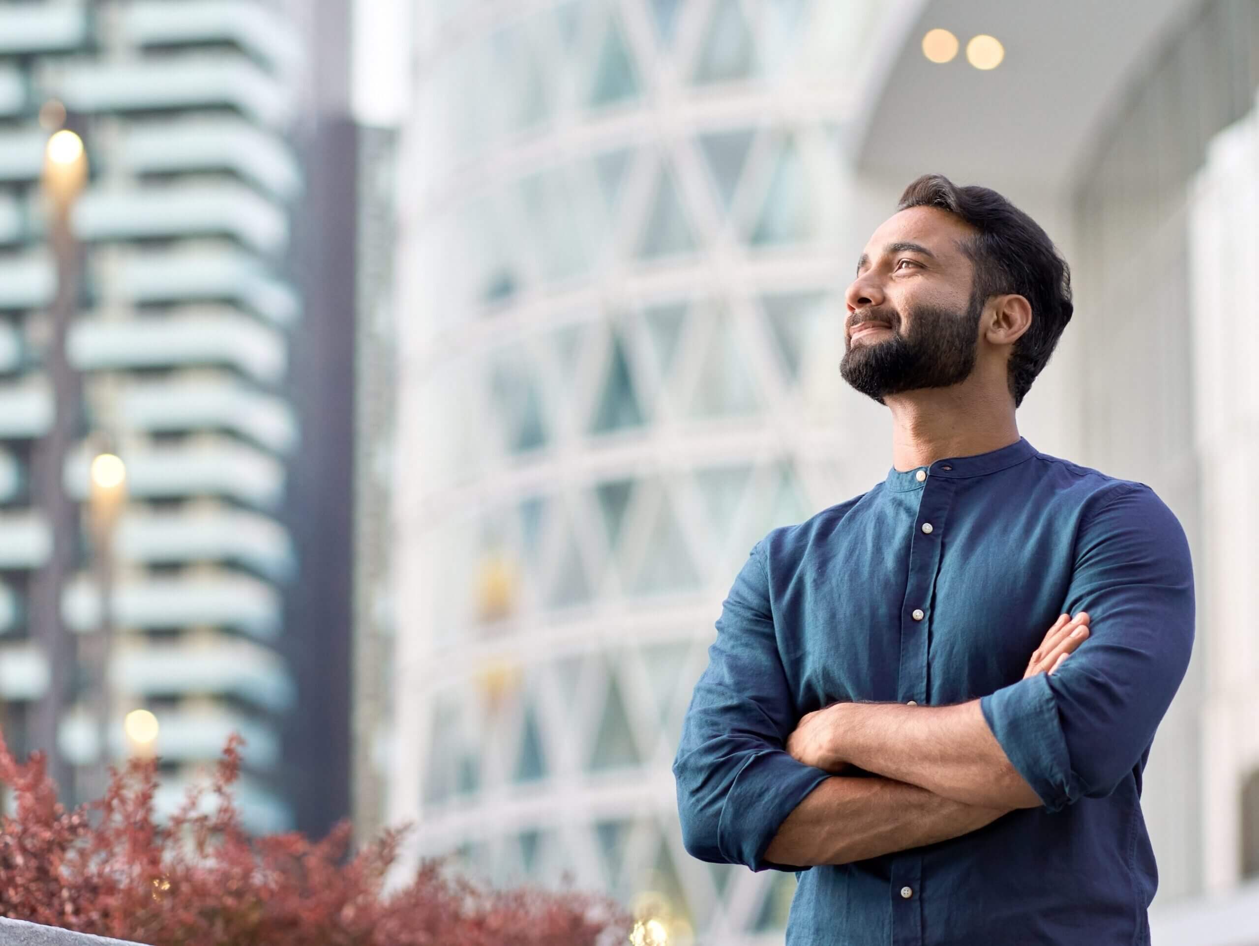 executive standing in modern big city